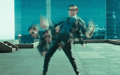 Man In Suit And Sunglasses Dancing On Rooftop GIF
