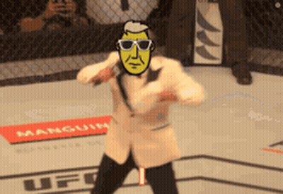 Man In Suit And Sunglasses In Boxing Ring With UFC Sign GIF