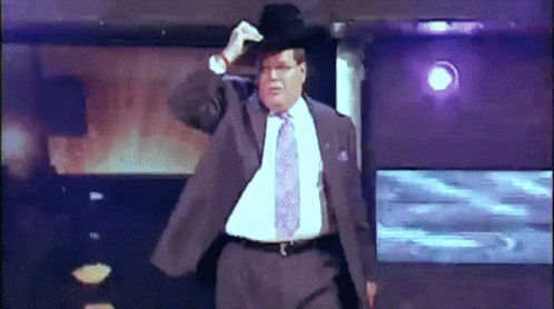 Man In Suit And Tie Adjusting Hat GIF