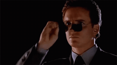 Man In Suit And Tie Adjusting Sunglasses GIF