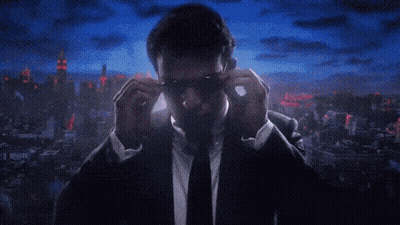 Man In Suit And Tie Adjusting Sunglasses GIF