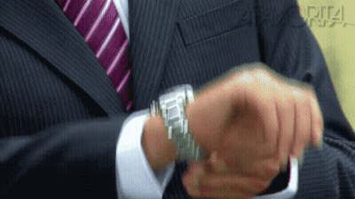 Man In Suit And Tie Adjusting Watch GIF