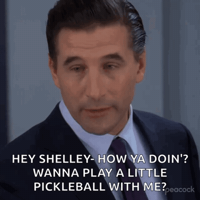 Man In Suit And Tie Asking Shelley To Play Pickleball GIF