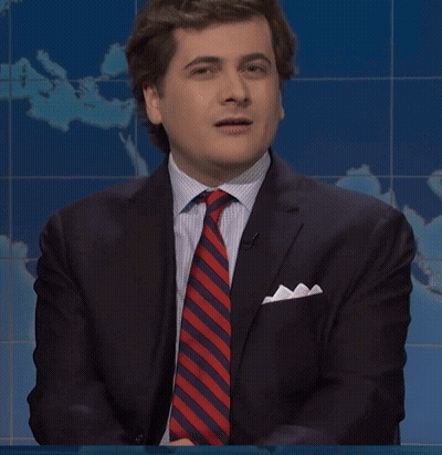 Man In Suit And Tie Asks What Are We Doing GIF