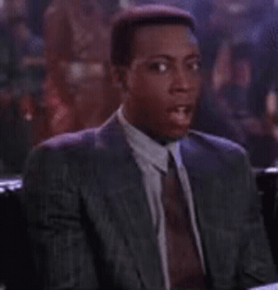 Man In Suit And Tie At Bar Table GIF