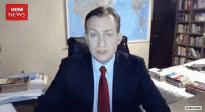 Man In Suit And Tie At BBC News Screen GIF