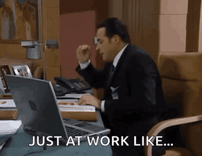 Man In Suit And Tie At Desk GIF