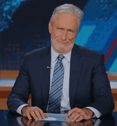 Man In Suit And Tie At Desk GIF
