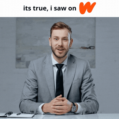 Man In Suit And Tie At Desk GIF