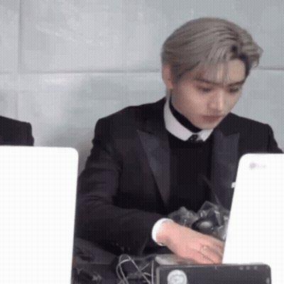 Man In Suit And Tie At Desk With Laptop GIF