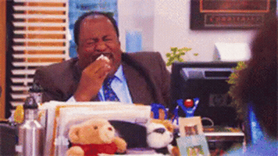 Man In Suit And Tie At Desk With Stuffed Animals GIF