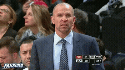 Man In Suit And Tie At Fansided Scoreboard GIF