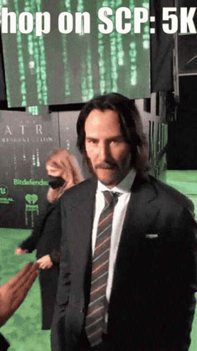 Man In Suit And Tie At Hop On SCP Sign GIF