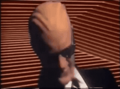 Man In Suit And Tie At Microphone GIF