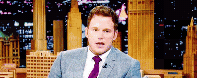 Man In Suit And Tie At Microphone GIF