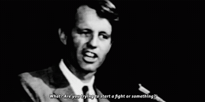 Man In Suit And Tie At Microphone GIF