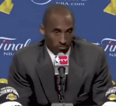 Man In Suit And Tie At Microphone GIF