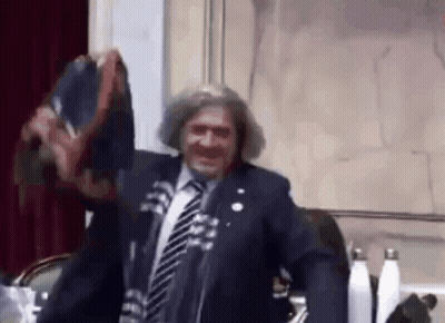 Man In Suit And Tie At Microphone GIF