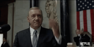 Man In Suit And Tie At Microphone GIF