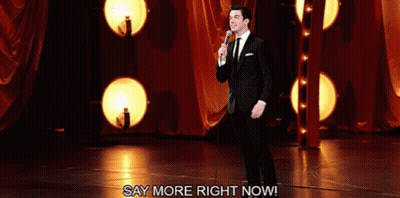 Man In Suit And Tie At Microphone GIF