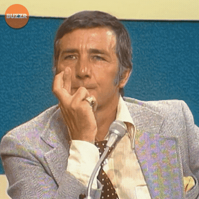 Man In Suit And Tie At Microphone GIF