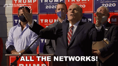 Man In Suit And Tie At Podium GIF