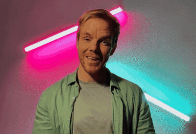 Man In Suit And Tie At Podium GIF