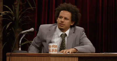 Man In Suit And Tie At Podium With Coffee GIF