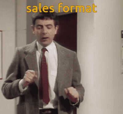 Man In Suit And Tie At Sales Format Wall GIF