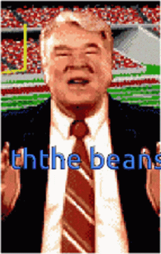Man In Suit And Tie At Stadium Ththe Beans GIF