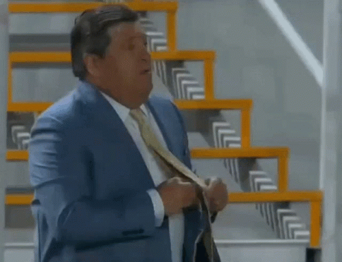 Man In Suit And Tie At Stairs GIF