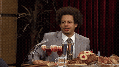Man In Suit And Tie At Table With Food GIF