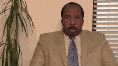 Man In Suit And Tie At Window GIF