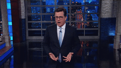 Man In Suit And Tie At Window GIF