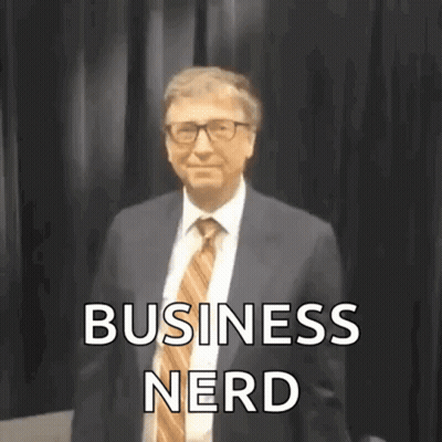 Man In Suit And Tie Before Black Curtain GIF