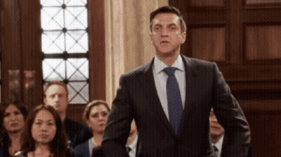 Man In Suit And Tie Before Crowd GIF