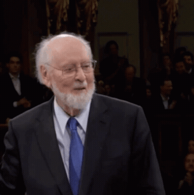 Man In Suit And Tie Before Crowd GIF