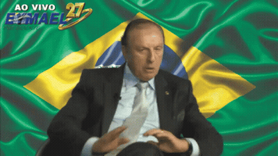 Man In Suit And Tie Before Flag Ao Vivo Emael 21 GIF