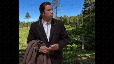 Man In Suit And Tie Before Forest GIF