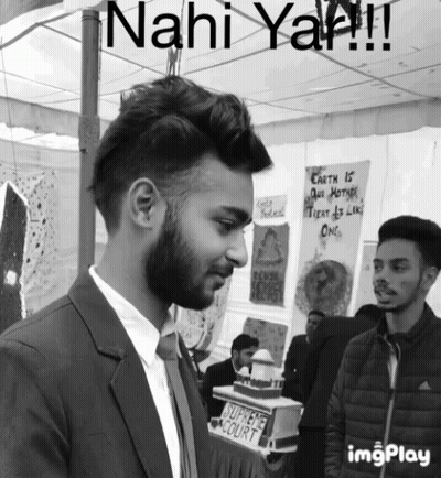 Man In Suit And Tie Before Sahi Court Sign GIF