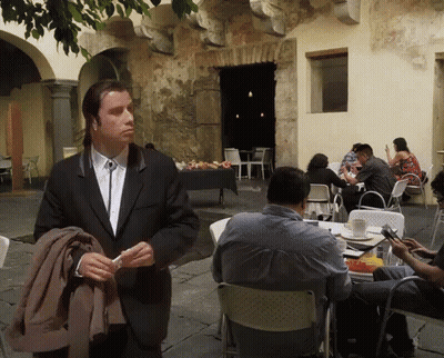 Man In Suit And Tie Before Seated Group GIF