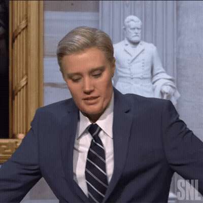 Man In Suit And Tie Before SNL Statue GIF
