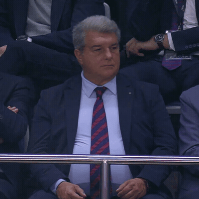 Man In Suit And Tie Behind Fence GIF