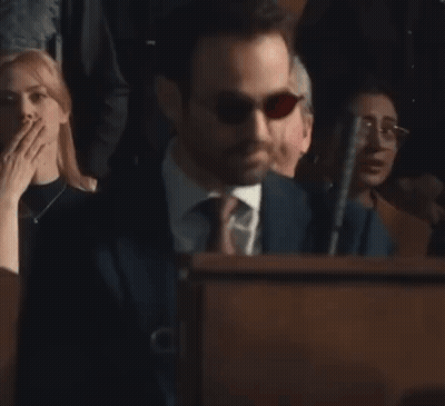 Man In Suit And Tie Behind Podium GIF