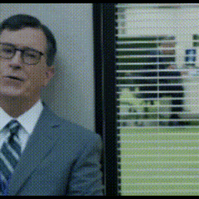 Man In Suit And Tie Beside Window With Blinds GIF