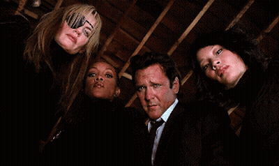 Man In Suit And Tie Between Two Women GIF