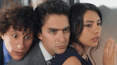 Man In Suit And Tie Between Two Women GIF