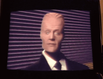 Man In Suit And Tie, Blue And Pink Checkered Background GIF