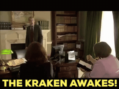 Man In Suit And Tie Bookshelf The Kraken Awakes GIF