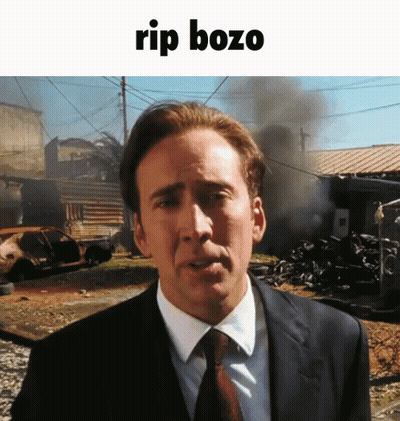 Man In Suit And Tie By Blue Wall 'Alaska 202 GIF
